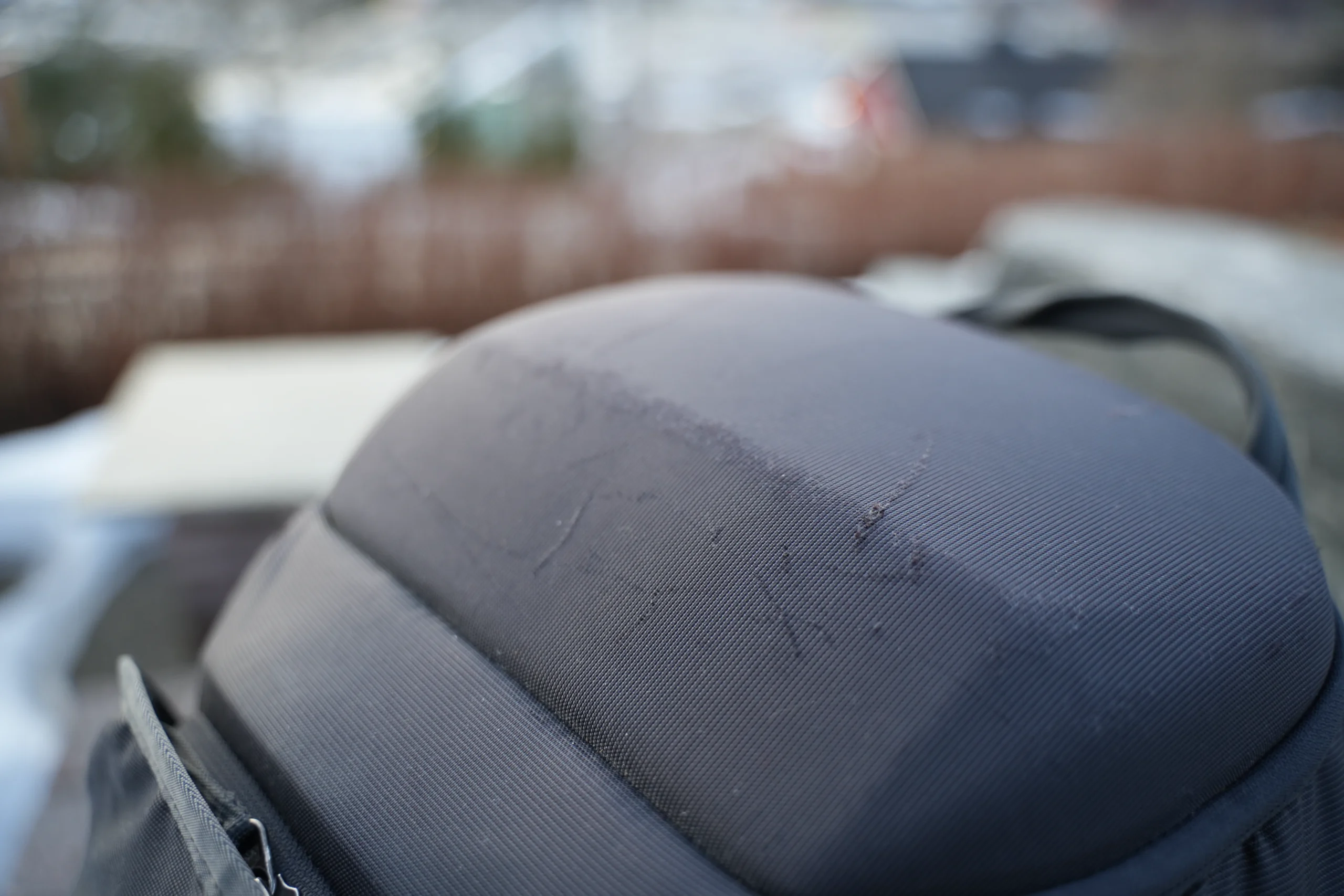 Thule Landmark 40 SafeZone shell showing scuffs and wear after years of use