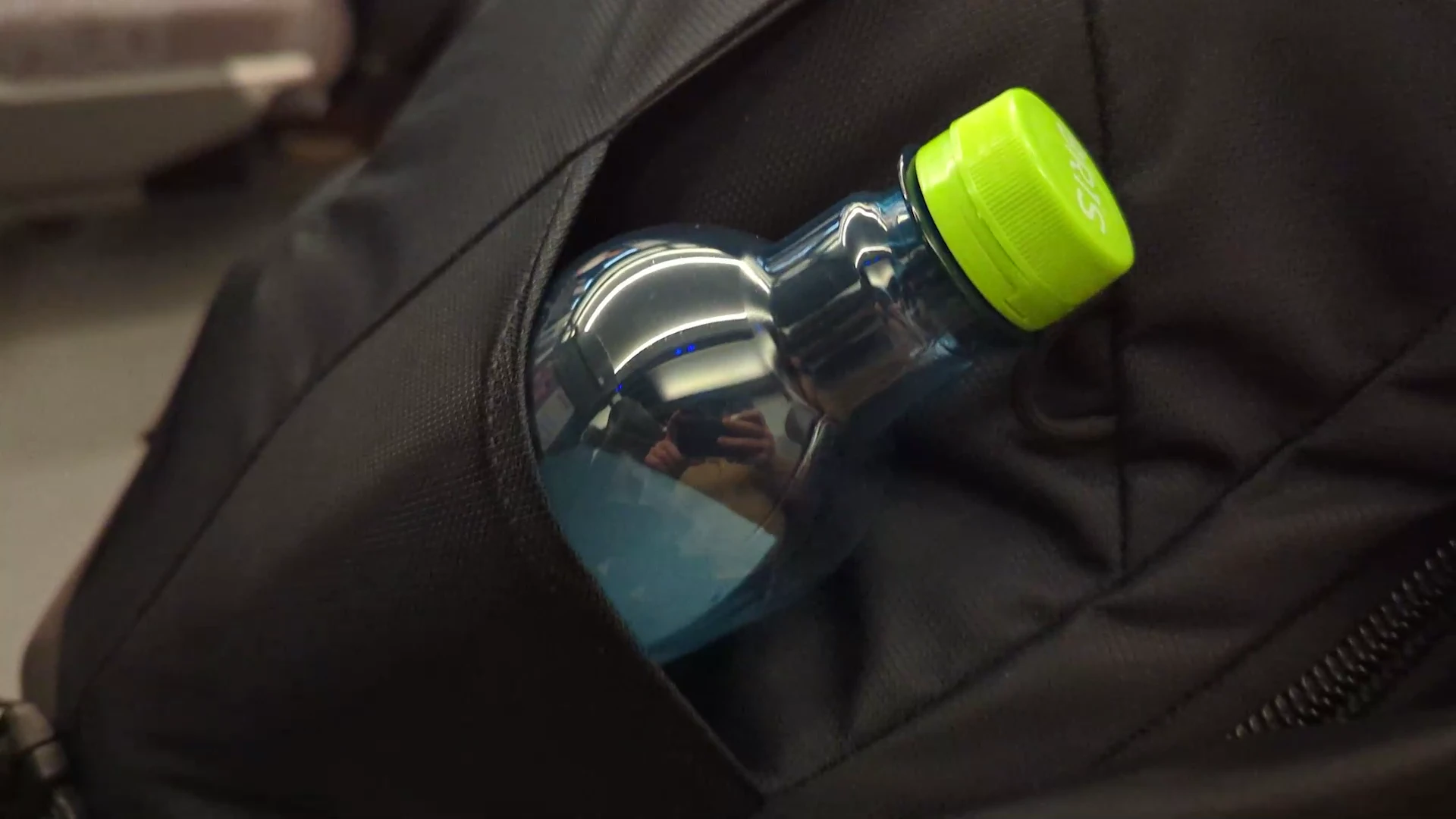 Water bottle stored in the Osprey Farpoint 40 front shove-it pocket