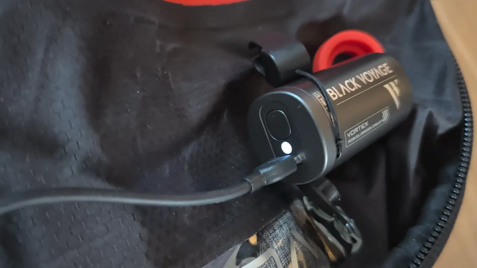 Black Voyage Vortex vacuum pump connected to the Zephyr Pro Lite