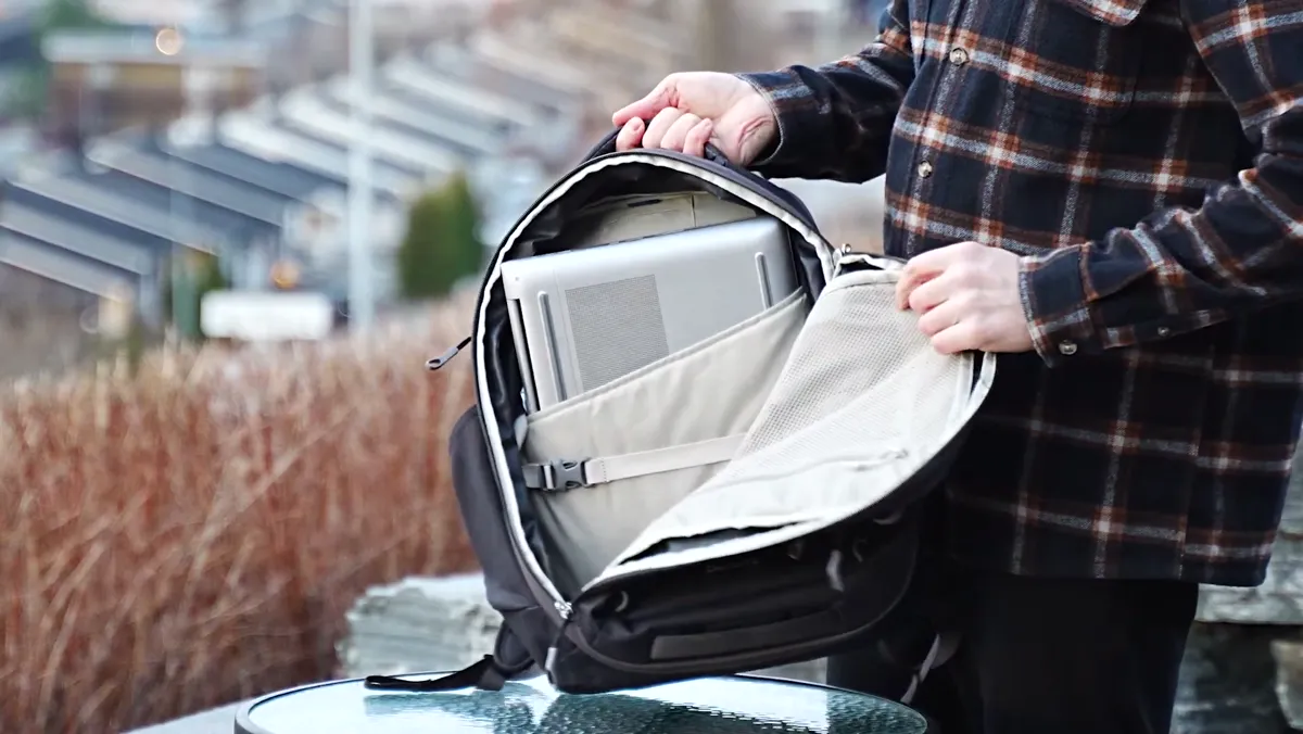 Osprey Daylite 26+6 opened up with a laptop loaded into the internal sleeve of a packed bag