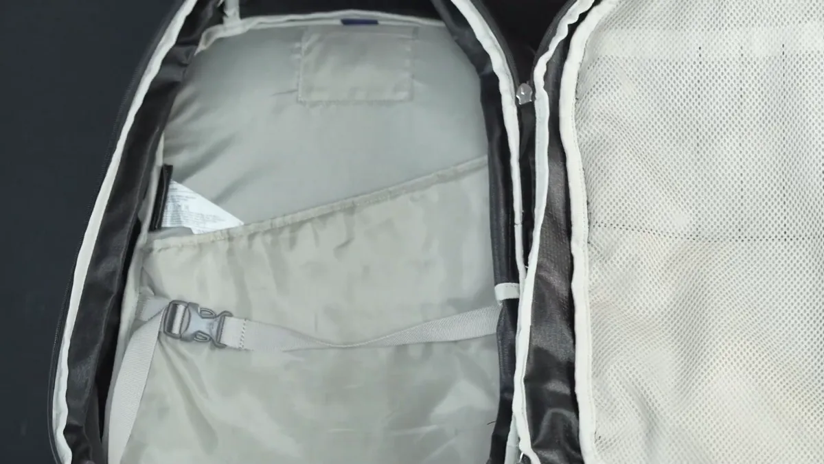 Inside the main compartment of the Osprey Daylite 26+6, showing the flat pocket and compression strap