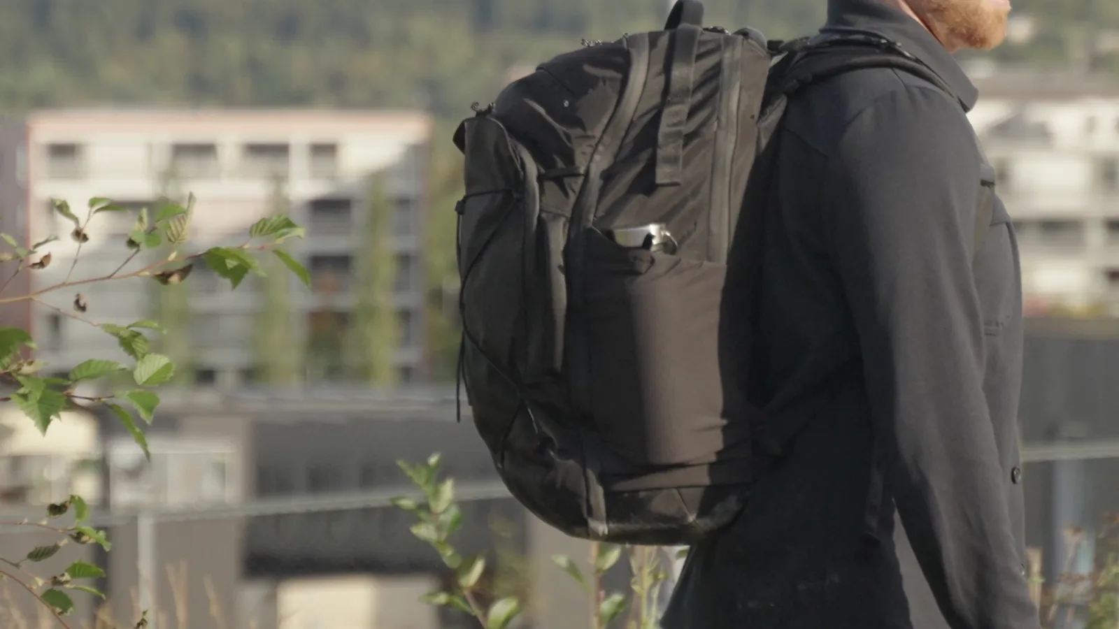 The Matador Global Travel Pack 35 worn outdoors, seen from the side
