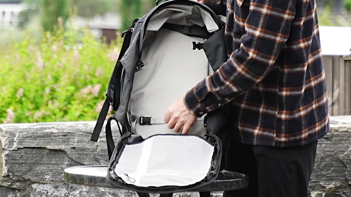 Osprey Farpoint 40 opened on a table, showing the main compartment and internal compression straps.